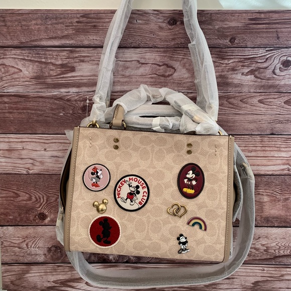 Coach Handbags - SOLD!! NWT DISNEY X COACH ROGUE 25 WITH MICKEY/MINNIE PATCHES